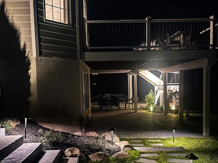 Residential hardscape creation with under deck and subsurface drainage renovation, landscape creation and low voltage lighting addition project in Jamison, PA